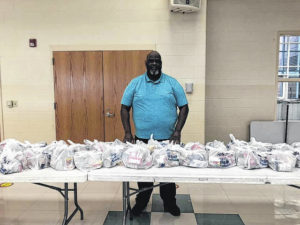 Principal Fred Davis delivers snacks to kids in need