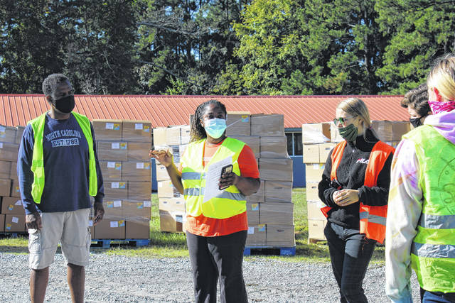 
			
				                                Angela Caraway, excutive director of the Caraway Foundation, prepares volunteers for the day of giving out produce boxes on Oct. 3 at the Ansonville Fire Department.
                                 Liz O’Connell | Anson Record

			
		