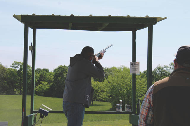 Participants in the Clays for Commerce fundraiser take turns in shooting orange clays at Hyatt Sporting Preserve in Polkton.