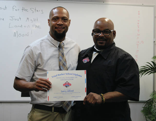 Triad Barber School honors its first graduate, Larry Allred, with a special graduation celebration on June 26.
                                 Liz O’Connell | Anson Record