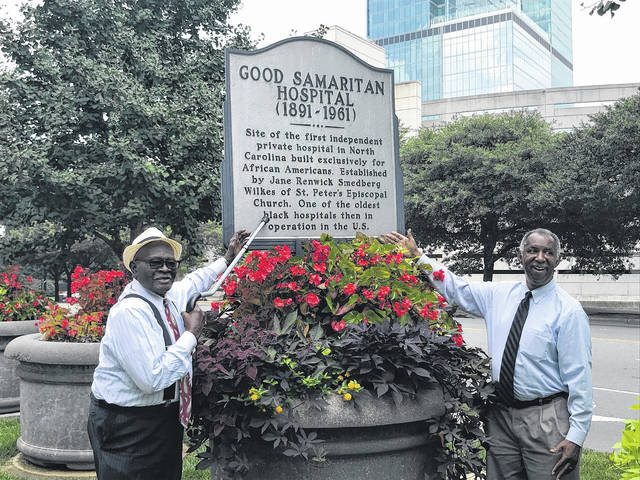 127392388_web1_1911-train-wreck
Dr. E. Victor Maafo, the former pastor of Hamlets St. Peters United Methodist Church visits the historic marker, which honors the Good Samaritan Hospital at Bank of America Stadium in Charlotte. With Dr. Maafo is Eddie Davis, a public historian in Durham.