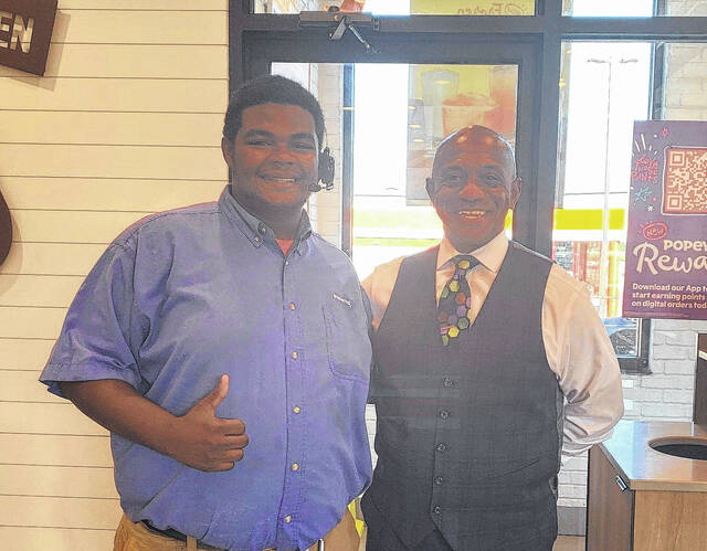 
			
				                                Jerel Miller, left, poses with Sheriff Garry McFadden at Popeyes over the weekend.
                                 Contributed photo

			
		