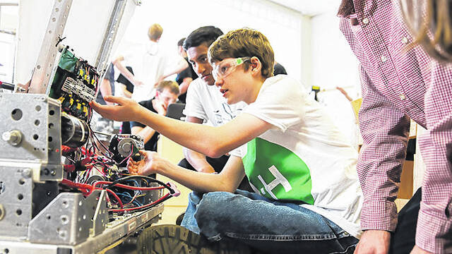 
			
				                                4-H students work on a project.
                                 Contributed photo

			
		