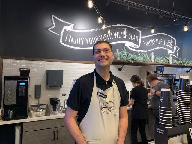 
			
				                                Dominic serves coffee with a smile.
                                 Hannah Barron | Anson Record

			
		