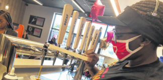 
			
				                                A Dunkin’ staff member fills a coffee order using the new coffee taps.
                                 Gavin Stone | Daily Journal

			
		