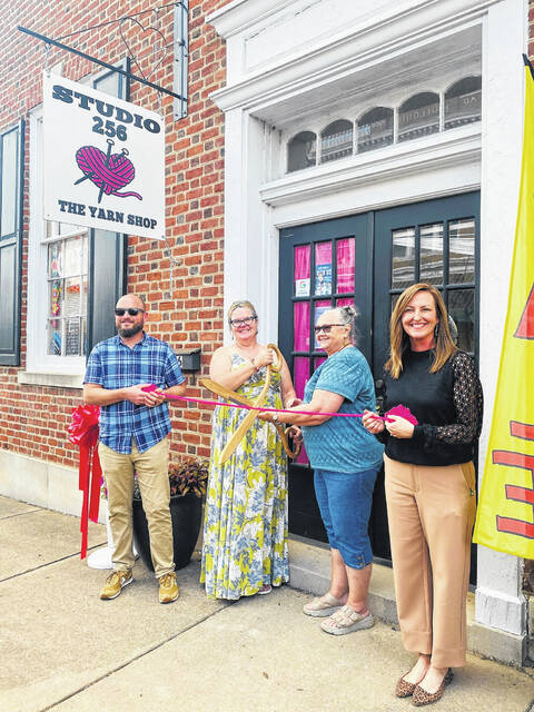 128550544_web1_Yarn
Heather Edwards (center, yellow) cutting the ribbon at the new location of Studio 256.
Photos courtesy of Anson County Chamber of Commerce
