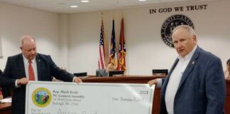 
			
				                                County Attorney Scott Forbes and Representative Mark Brody proudly posed with the $11,150,000 check made out to Anson County.
                                 Lauren Monica | Anson Record 

			
		