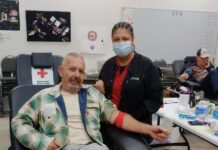 
			
				                                County Commissioner JD Bricken comes out to lead by example. After giving blood, Bricken enjoyed a Christmas cookie and left the proud owner of Christmas Elf socks that were given as a token of appreciation to all those who came out and donated the gift of life to a stranger in need.
 
			
		