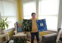 
			
				                                Toni Rorie holds up some of her favorite art pieces while standing in one of her favorite places, the Caraway Foundation 
                                 Lauren Monica | Anson Record

			
		