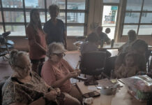 
			
				                                Another sucess, Yvonne Howland (seated front, left) was proud to be out not only knitting in public, but also to show her daughter support.
 
			
		