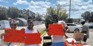 
			
				                                Erica Reid (middle) got some advertising help from Evian Johnson (left) and “Maintain” Garland Daudy (right).
                                 Lauren Monica | Anson Record

			
		
