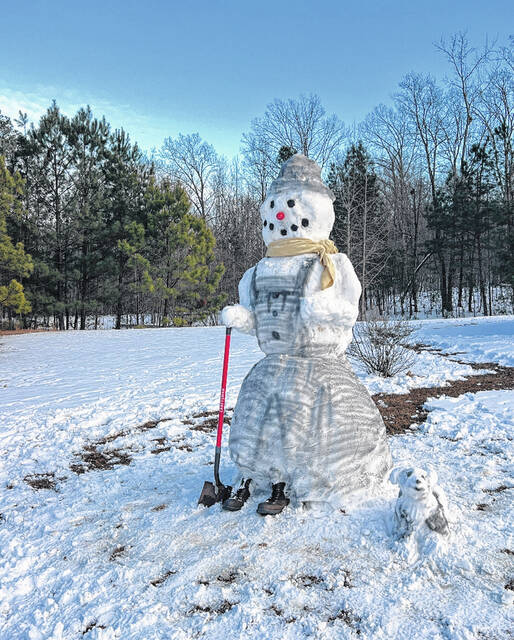 Check out this snowman (and his little dog!) completed by Alan and Andrew James. This is very cool.
(Submitted).